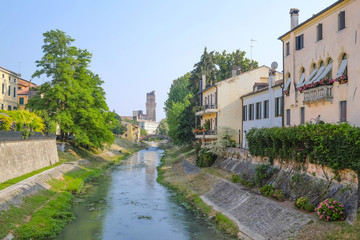 Poster - PADOVA, ITALY - JULY, 9, 2016: buildings on a river bank in Padova, Italy