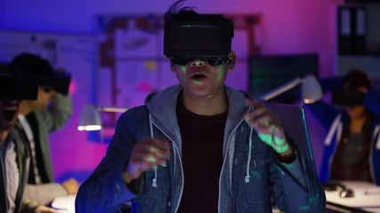 Wall Mural -  Young computer programmers trying out virtual reality viewers