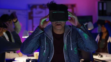 Wall Mural -  Young computer programmers trying out virtual reality viewers
