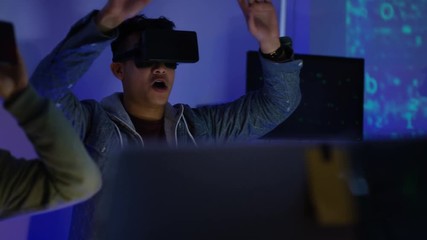 Wall Mural -  Young computer programmers trying out virtual reality viewers