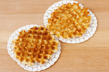 Wall Mural - Waffles on a wooden background. Breakfast, dessert.