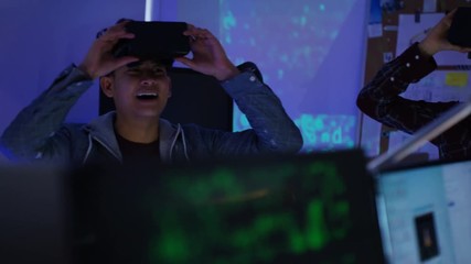 Wall Mural -  Young computer programmers trying out virtual reality viewers