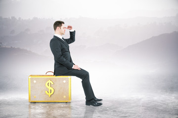 Poster - Man sitting on dollar suitcase