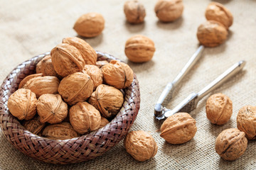 Canvas Print - Walnuts in a basket on a table