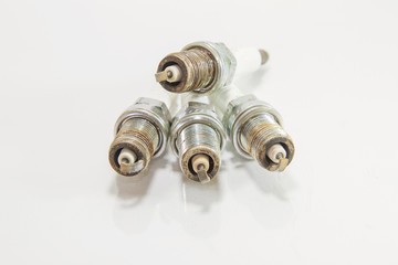 Used spark plug on white background