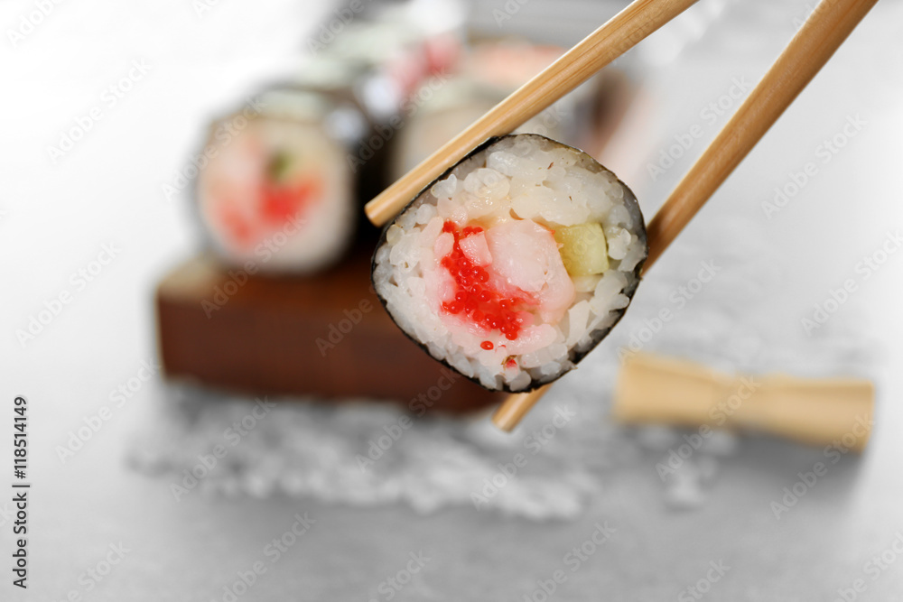 Delicious sushi set on wooden board