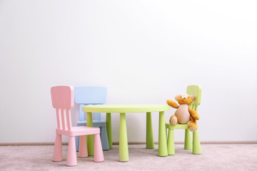 Wall Mural - Children furniture with toy on white wall background