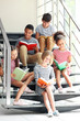 © Africa Studio - Cute kids reading books on stairs