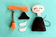 Fun Halloween sewing project for kids. Join the pieces of felt witch using a simple running stitch. Make a broom out of felt and wood branch. Sew Halloween witch doll. Step. Closeup. Top view