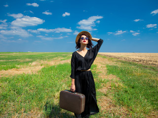 Wall Mural - young woman with suitcase