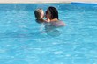 © markim - A mother and young daughter having fun in a swimming pool while on vacation, 2016