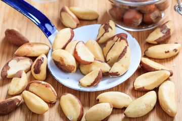 Wall Mural - Brazil nuts and an old ladle