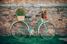 Beautiful Vintage Bicycle With Flowers In Baskets