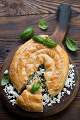 Wall Mural - Burek or burekas pie with cheese and spinach, selective focus