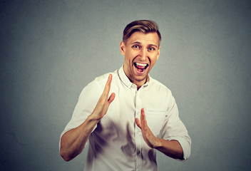 angry man raising hands in air attack with karate chop