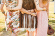 © Nabokov Alex - Three cute beautiful hippie girl in the setting sun, outdoors, the best of friends hugging and having fun, long hair, feathers in their hair, bracelets, flash tattoo, indie, Bohemia, boho style