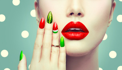 Watermelon nail art and makeup closeup over polka dots background