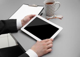 Poster - Businessman with tablet in office