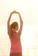 © Africa Studio - Young woman doing exercises on pier