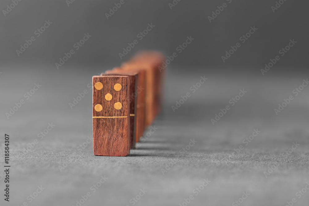 Wooden dominoes on grey table
