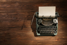Vintage Typewriter On A Wooden Background