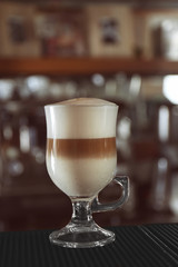 Wall Mural - Latte on blurred bar background