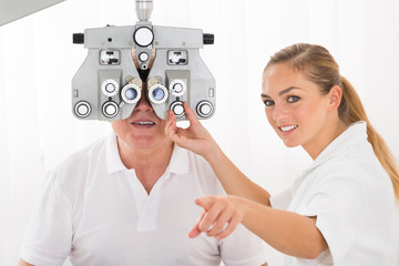 An Optometrist Doing Sight Testing For Patient