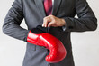 © twinsterphoto - Business man taking off their boxing gloves as he gives up on tasks