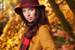 © ZoomTeam - Sensual beautiful young woman in autumn park in a maroon hat
