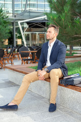 Businessman sitting on bench