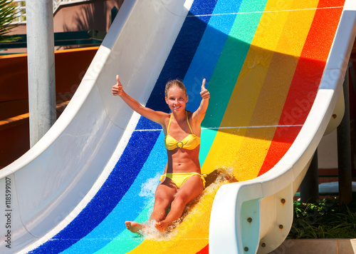 nice-beautiful-girl-on-water-slide-at-water-park-show-thumb-up-water