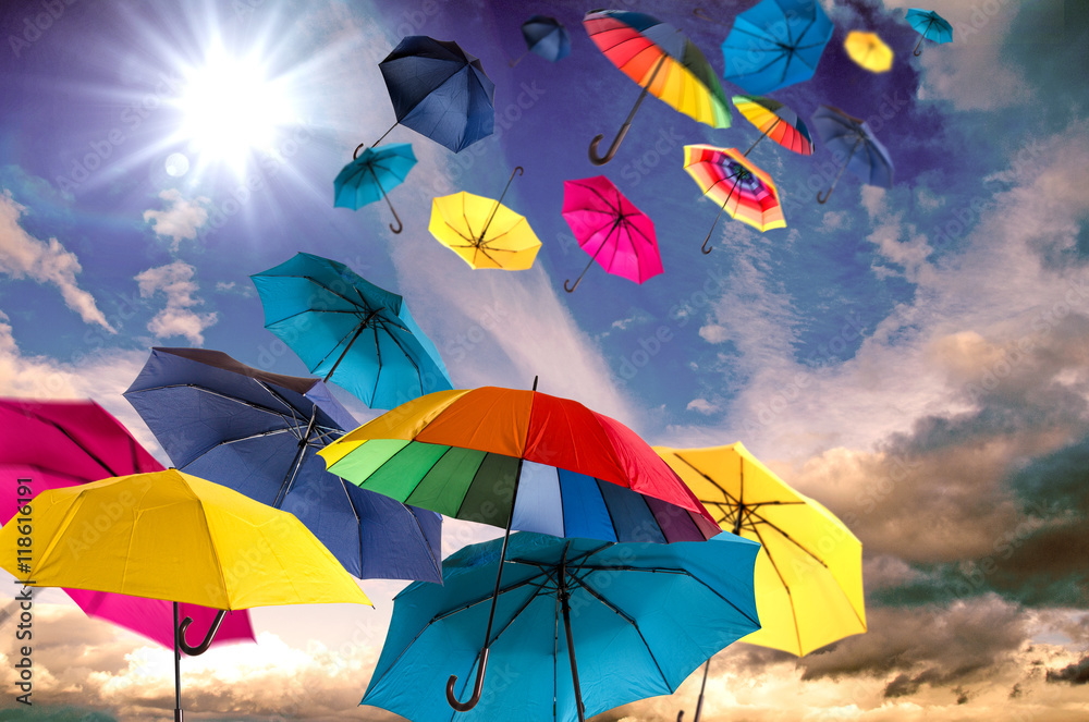Happiness, lust for life: flying colorful umbrellas on in front of blue sky :) - obrazy, fototapety, plakaty 