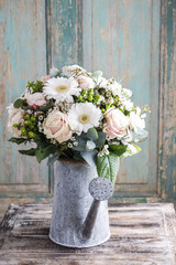 Wall Mural - Bouquet of pink roses and white gerbera flowers in grey watering