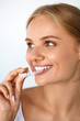 © puhhha - Smiling Woman With Beautiful Smile Using Invisible Teeth Trainer. High Resolution Image