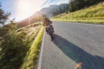 Wall Mural - Motorcycle driver riding on motorway