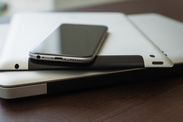 Aufkleber - close up phone on tablet and laptop, new technology concept