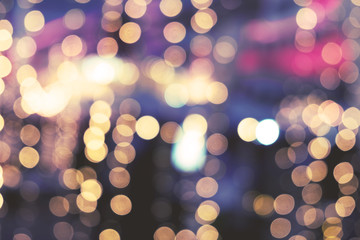 Wall Mural - christmas abstract blur background - light bokeh from xmas tree at night party in winter. vintage co