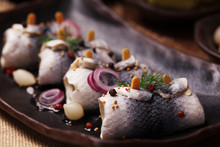 Rolled Herring In Vinegar, Served With Onions And Pickles.