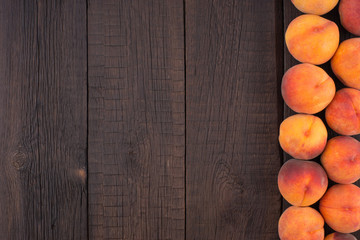 Ripe peaches on old rustic table.