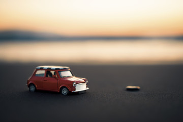 Mini cooper toy car on the beach