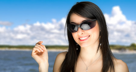 Canvas Print - Beautiful young woman at the seaside