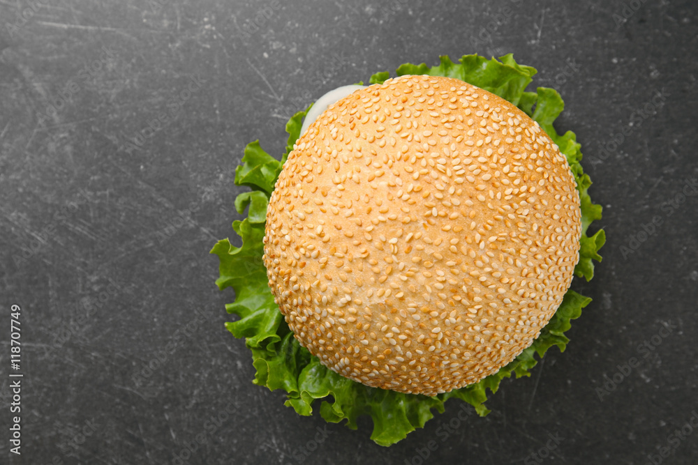 Tasty hamburger on table