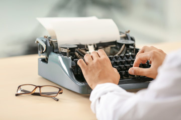 Poster - Man working on retro typewriter at desk