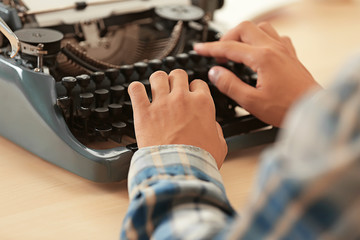Poster - Man working on retro typewriter at desk