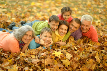 Wall Mural - Happy family in autumn forest