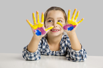 Wall Mural - Little girl with hands in paint