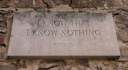 The phrase I know that I know nothing, sometimes called the Socratic paradox, is a saying that is derived from Plato's account of the Greek philosopher Socrates. Engraved text.