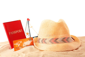 Credit card and passport on the sand, white background