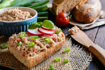 Wall Mural - Slices of baguette with tuna spread, red pepper and green onion