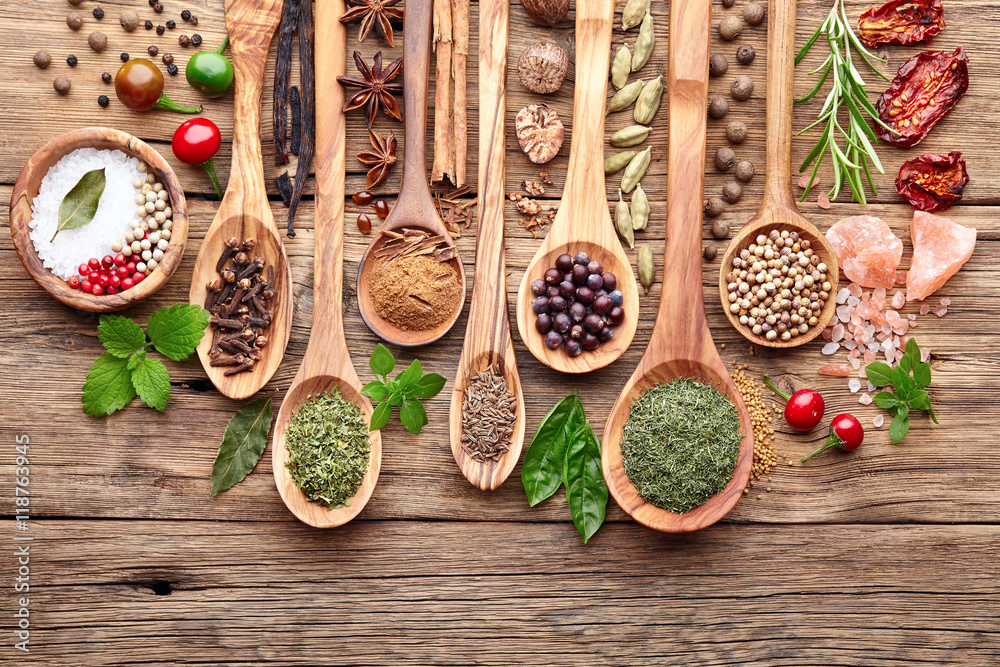Spices with fresh herbs on a wooden background - obrazy, fototapety, plakaty 